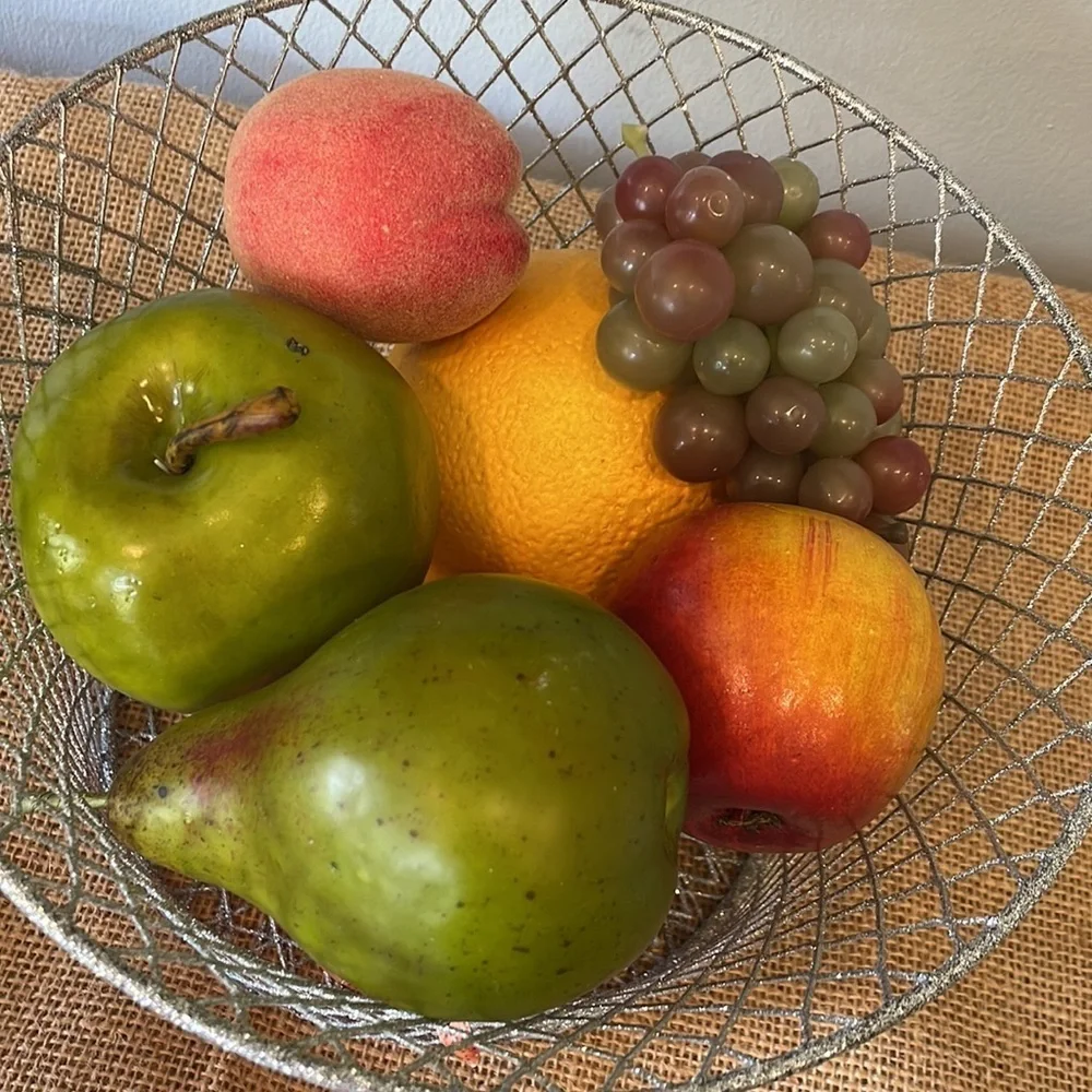 Silver sparkly wire basket full of decorative fruit